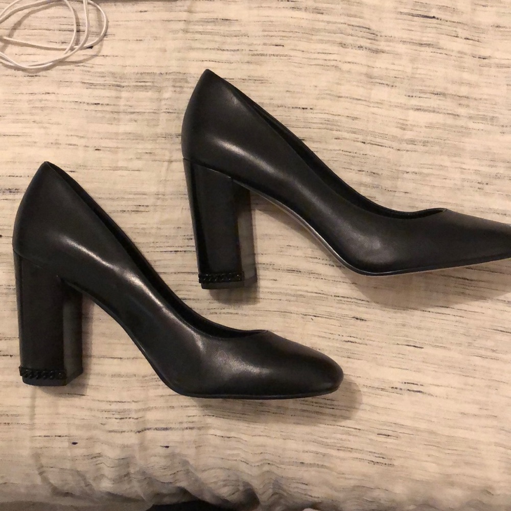 Michael kors black heels with chain on heel.